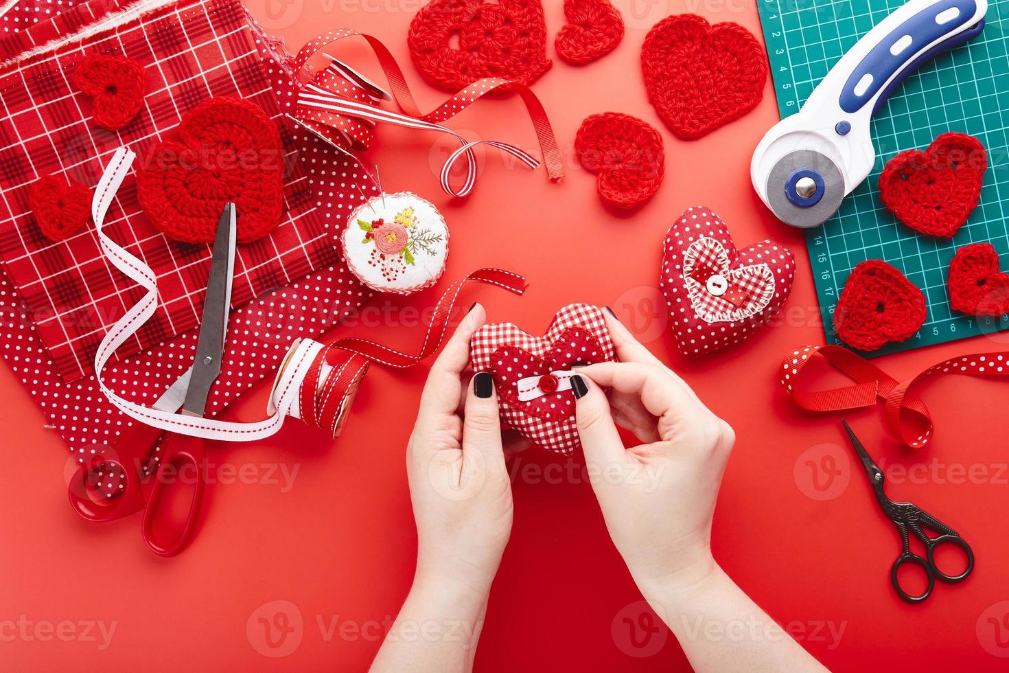 Top view of materials for sewing and knitting. Valentine's day handmade gifts background photo