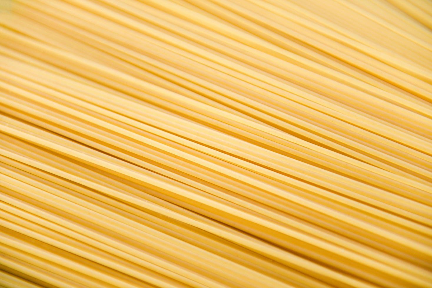 raw spaghetti italian pasta uncooked spaghetti texture background ready to cook in the restaurant italian food and menu photo