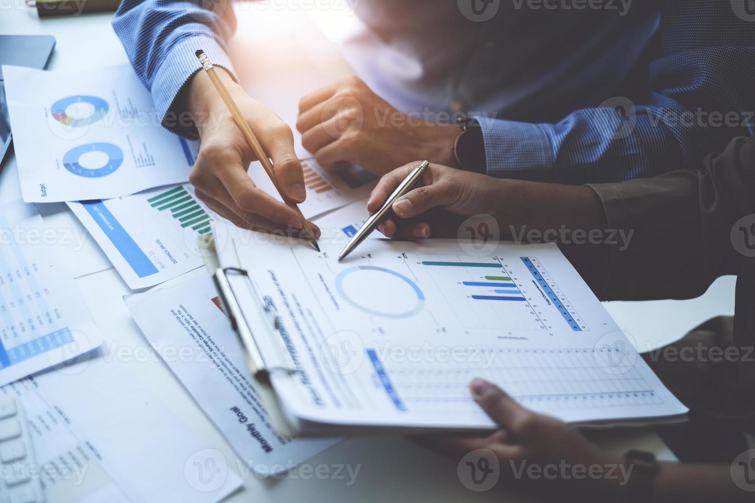 Group of Business people and Accountant checking data document on digital tablet for investigation of corruption account . Anti Bribery concept. photo