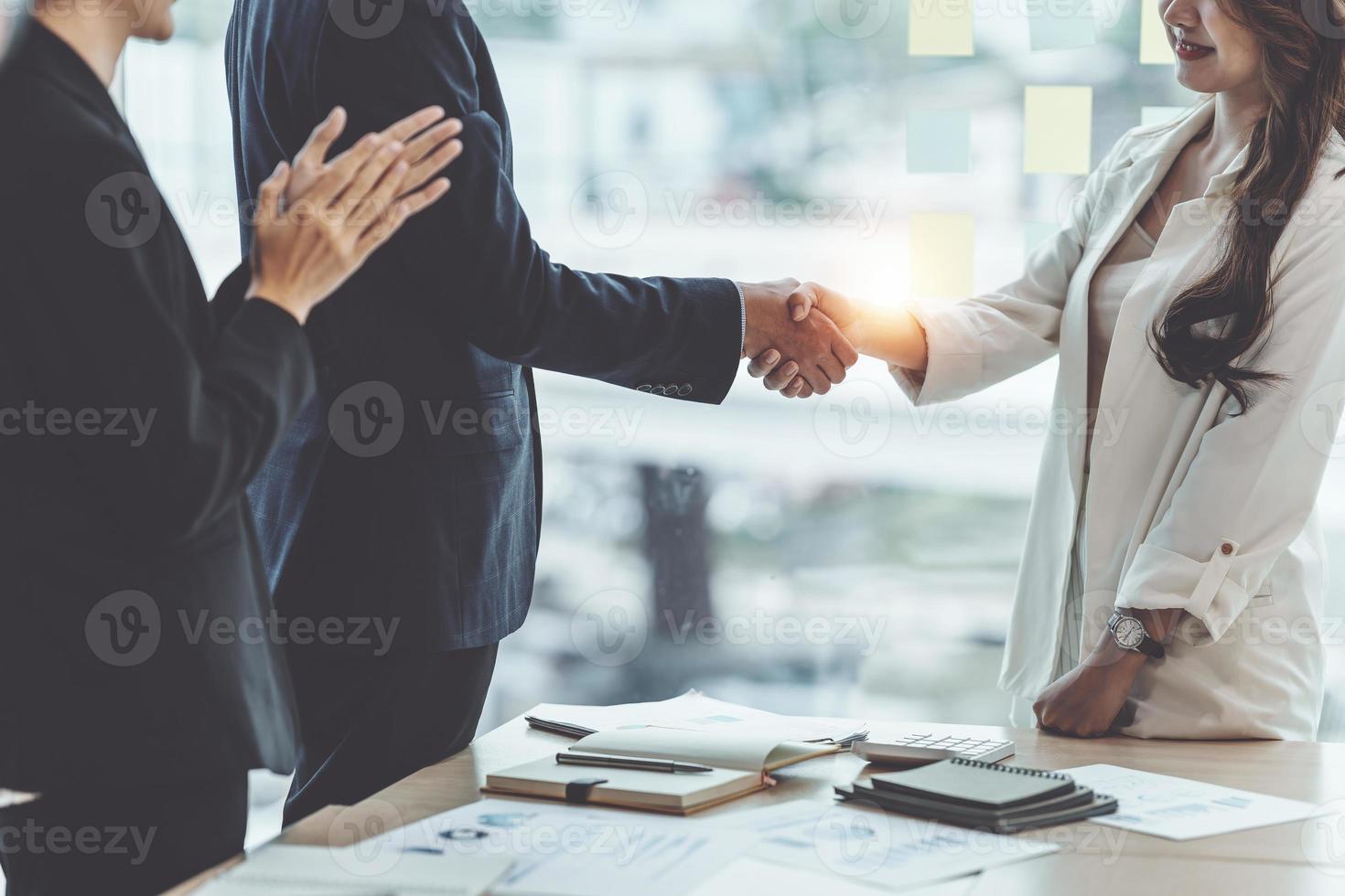 Business partnership meeting concept. Image business women handshake. Successful business people handshaking after good deal. Group support concept. photo