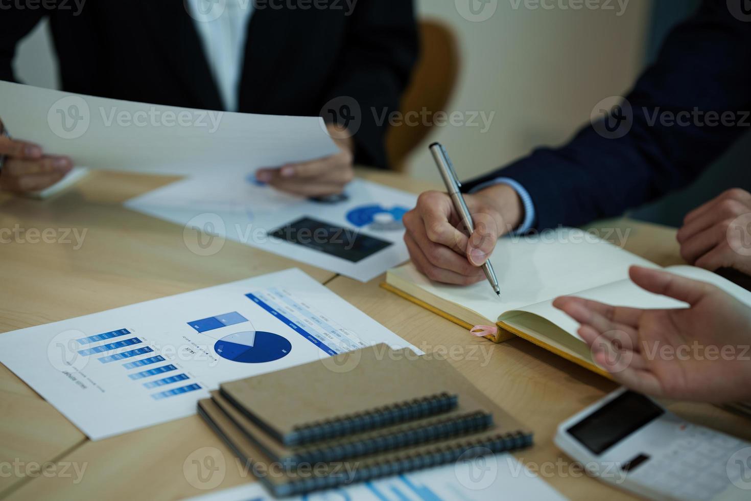 Group of Business people and Accountant checking data document on digital tablet for investigation of corruption account. Anti Bribery concept. photo