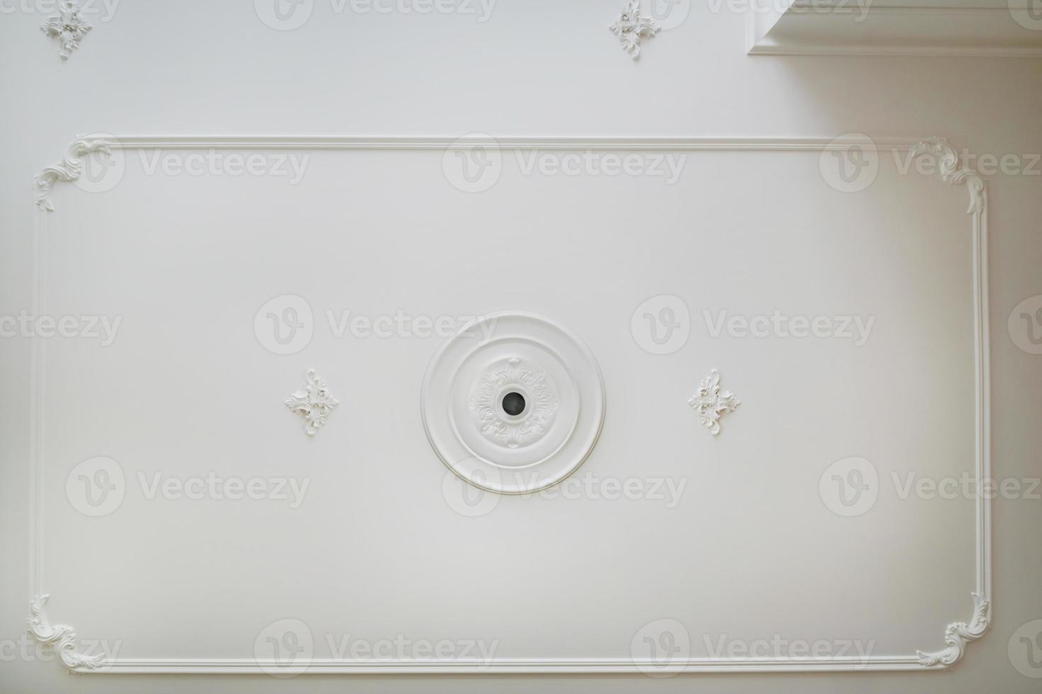 Detail of corner ceiling cornice with intricate crown molding. photo