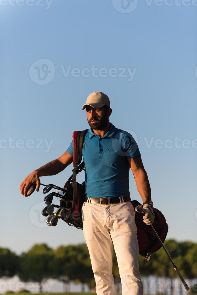 golfer  portrait at golf course on sunset photo