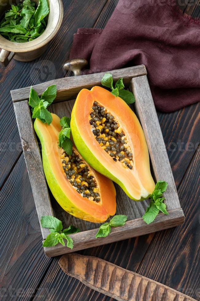 Papaya in the wooden box photo