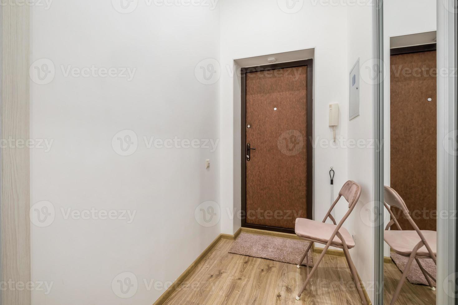 long empty corridor in interior of entrance hall of modern apartments, office or clinic with many doors photo