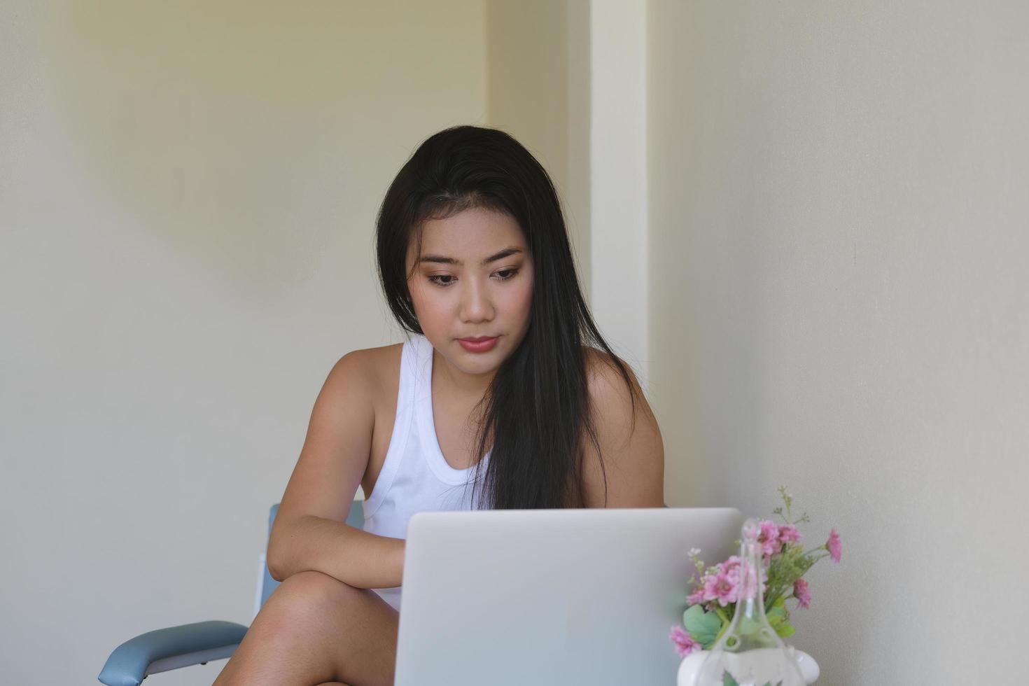 new normal, a businesswoman using computer to work for a company Via the internet on your desk at home. photo