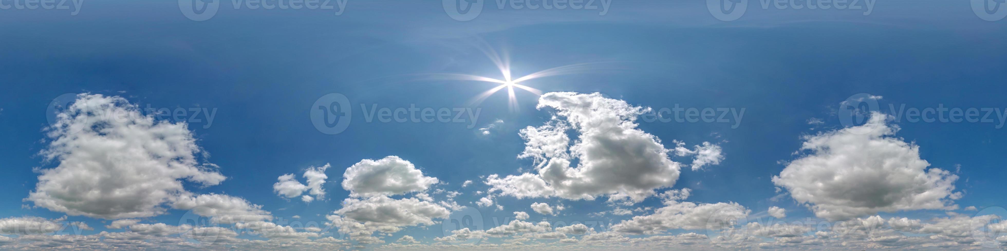 blue sky hdri 360 panorama with white beautiful clouds in seamless projection with zenith for use in 3d graphics or game development as sky dome or edit drone shot for sky replacement photo
