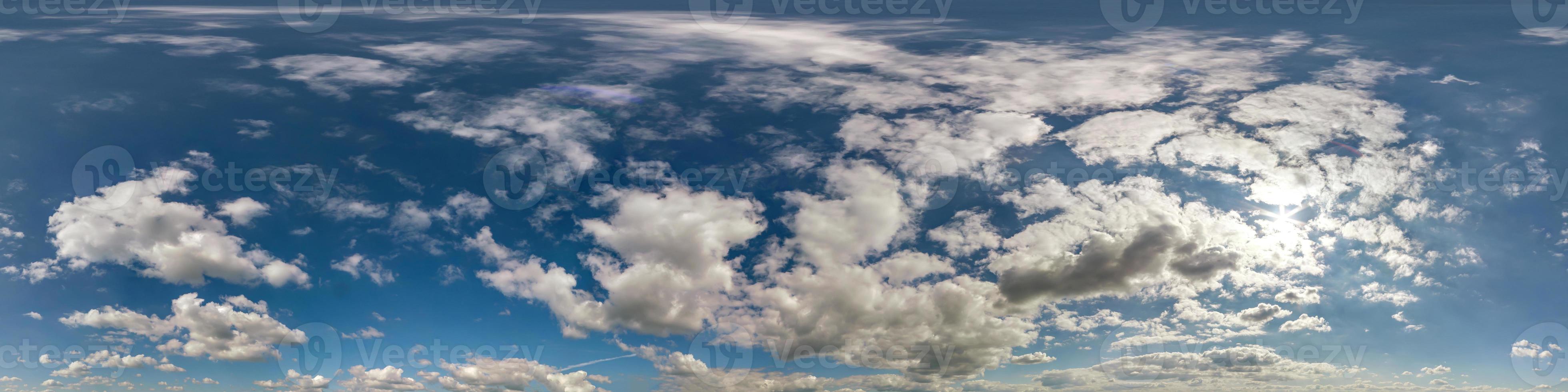blue sky hdri 360 panorama with white beautiful clouds in seamless projection with zenith for use in 3d graphics or game development as sky dome or edit drone shot for sky replacement photo