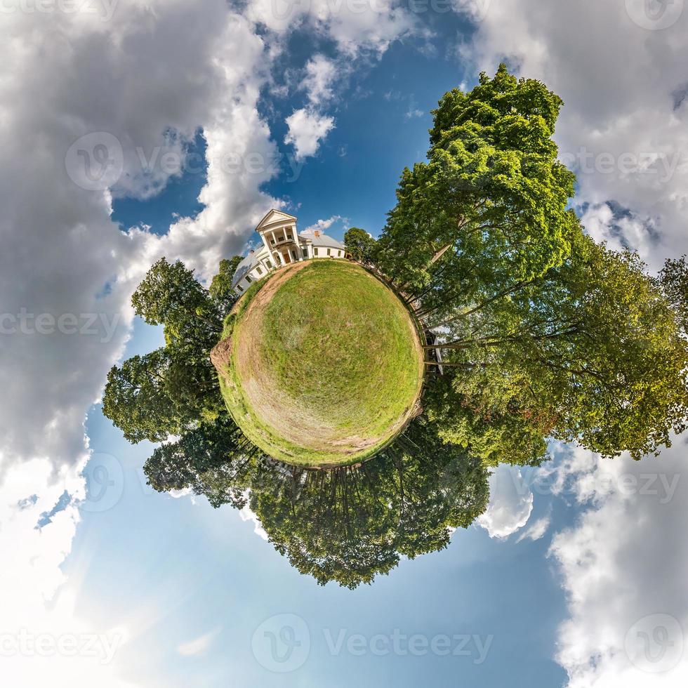 tiny planet with road in blue sky with beautiful clouds. Transformation of spherical panorama 360 degrees. Spherical abstract aerial view. Curvature of space. photo