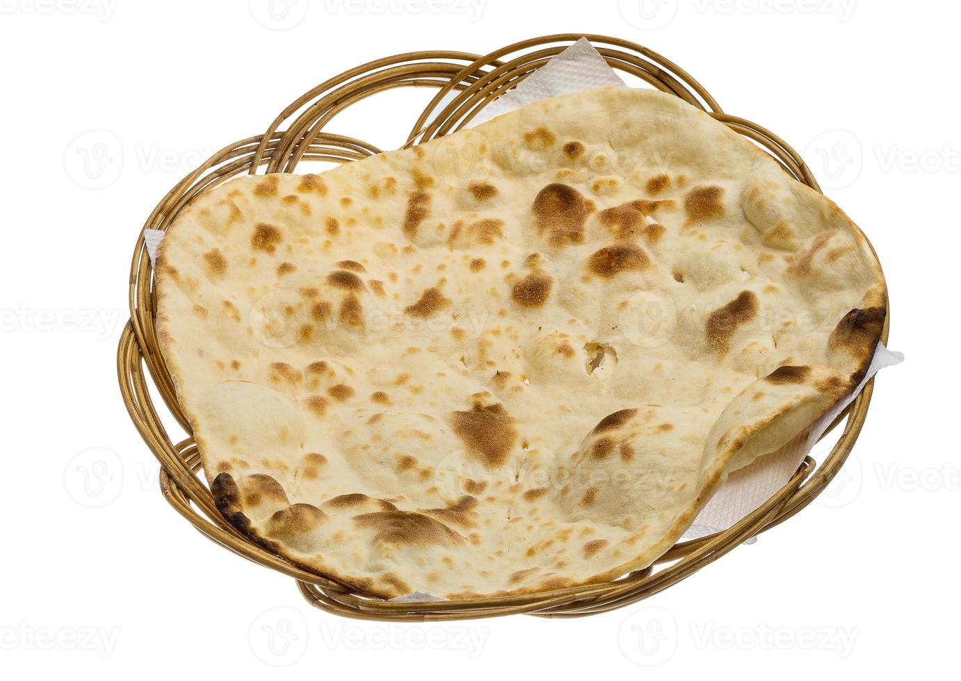 Plain Naan in a basket on white background photo
