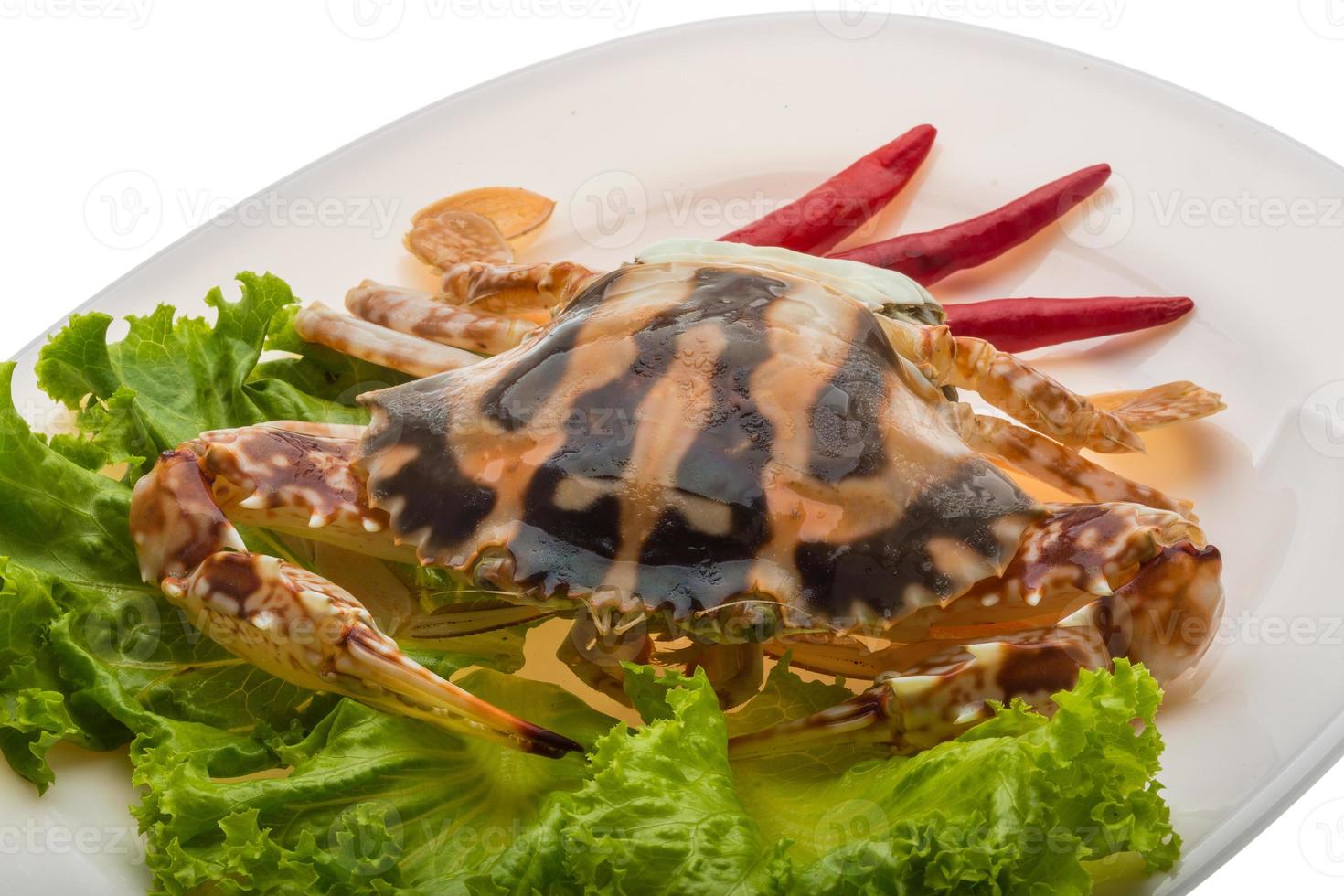 Red crab on the plate and white background photo