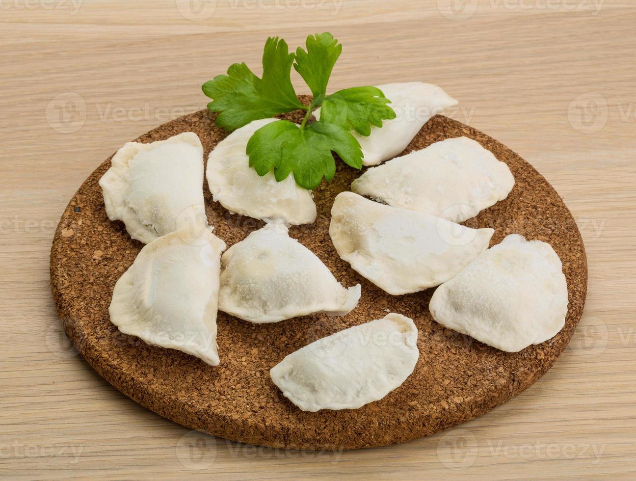 Ukrainian vareniki on wooden background 10898941 Stock Photo at Vecteezy