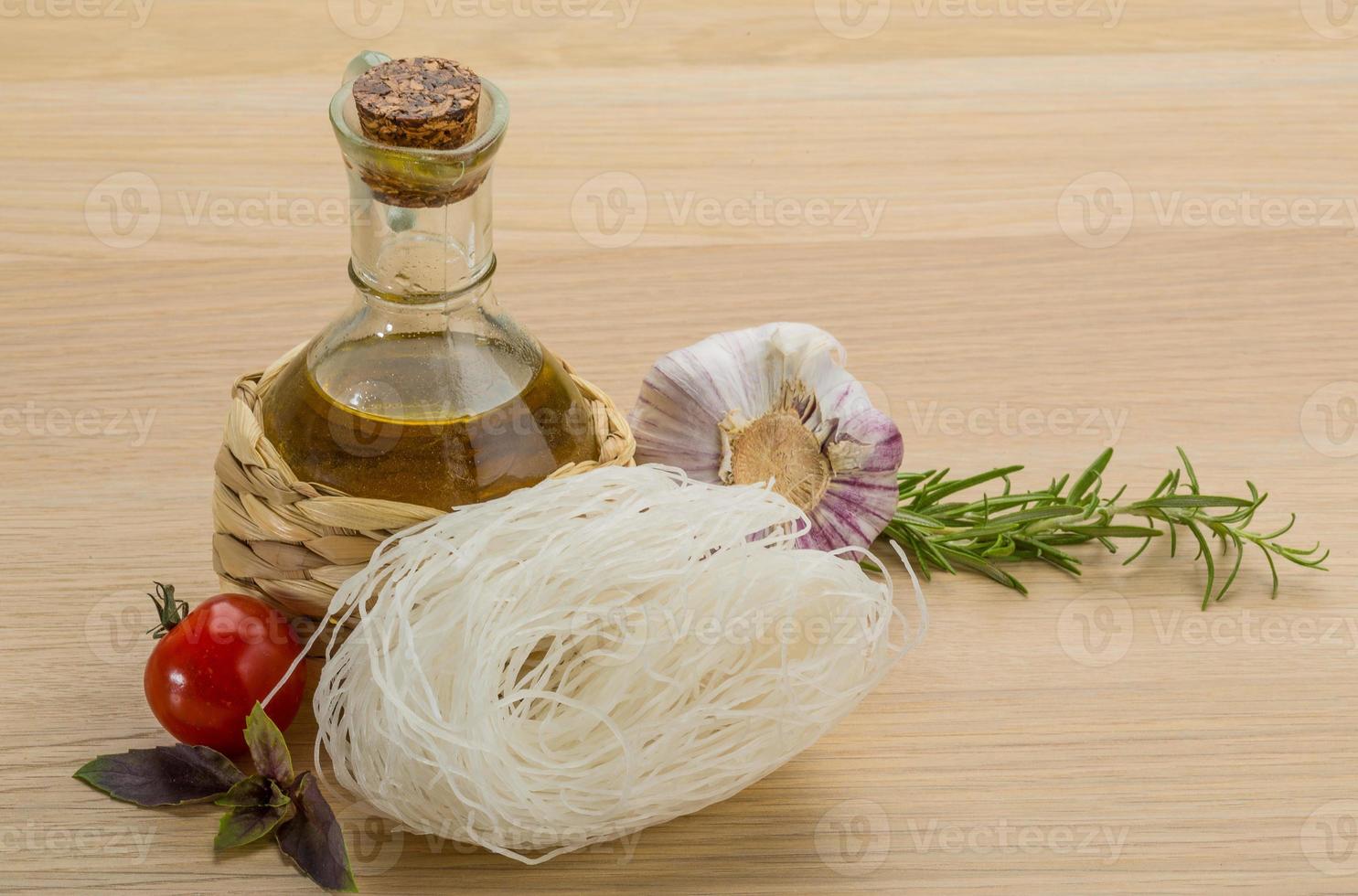 Rice noodle on wooden background photo