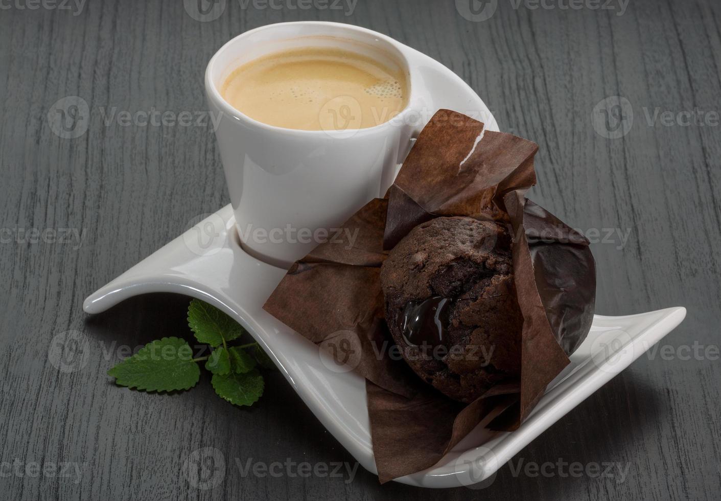 Coffee with muffin on wooden background photo