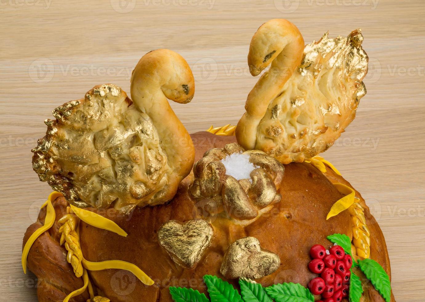 Karavay - Russian traditional bread on wooden background photo