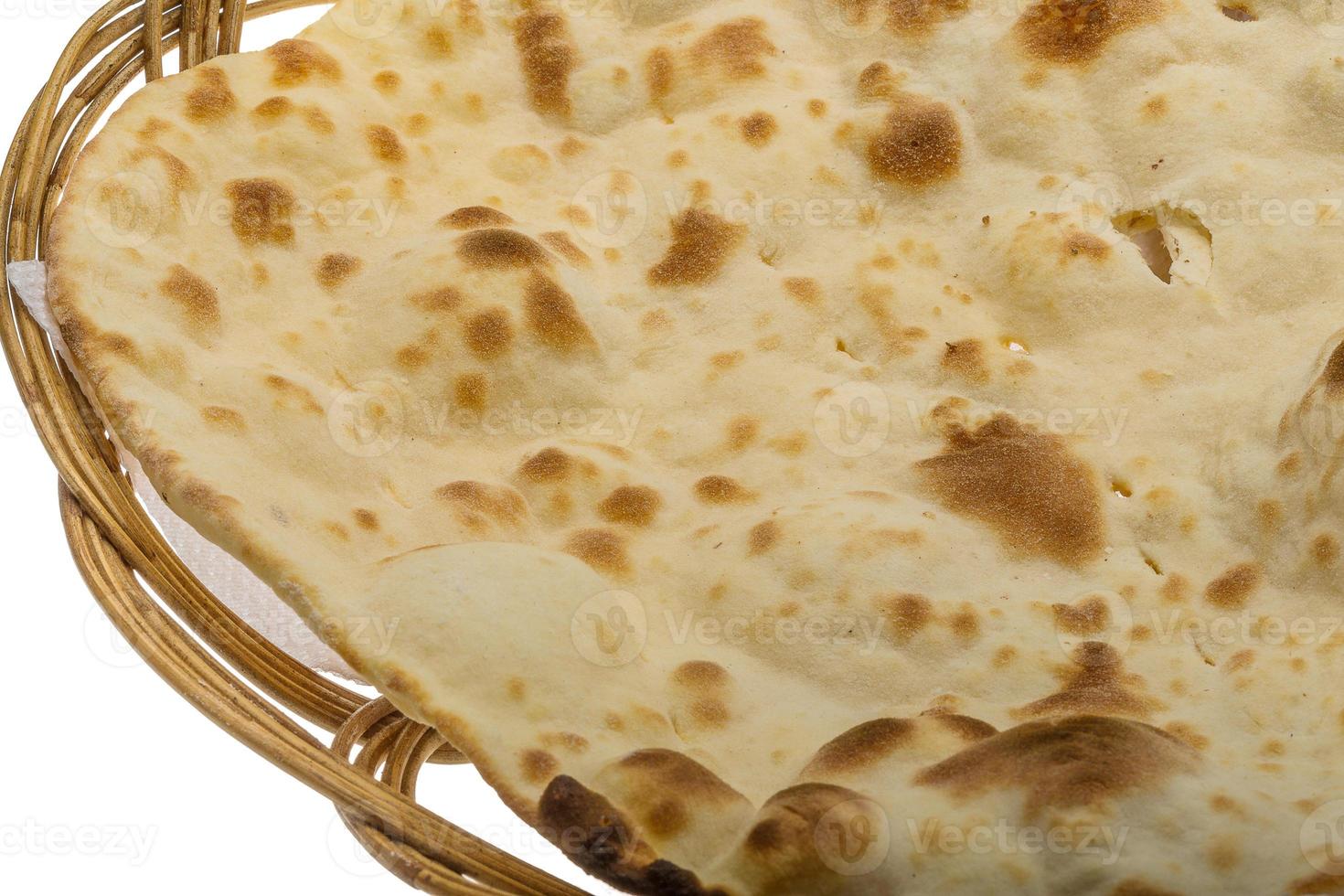 Plain Naan in a basket on white background photo