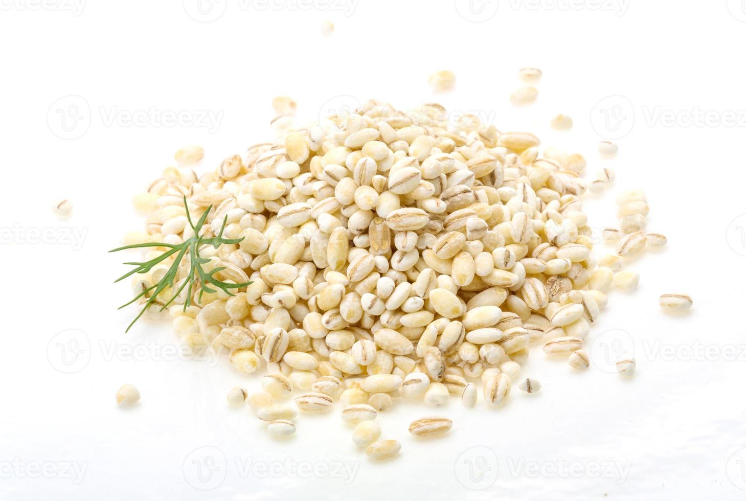 Pearl barley on white background photo