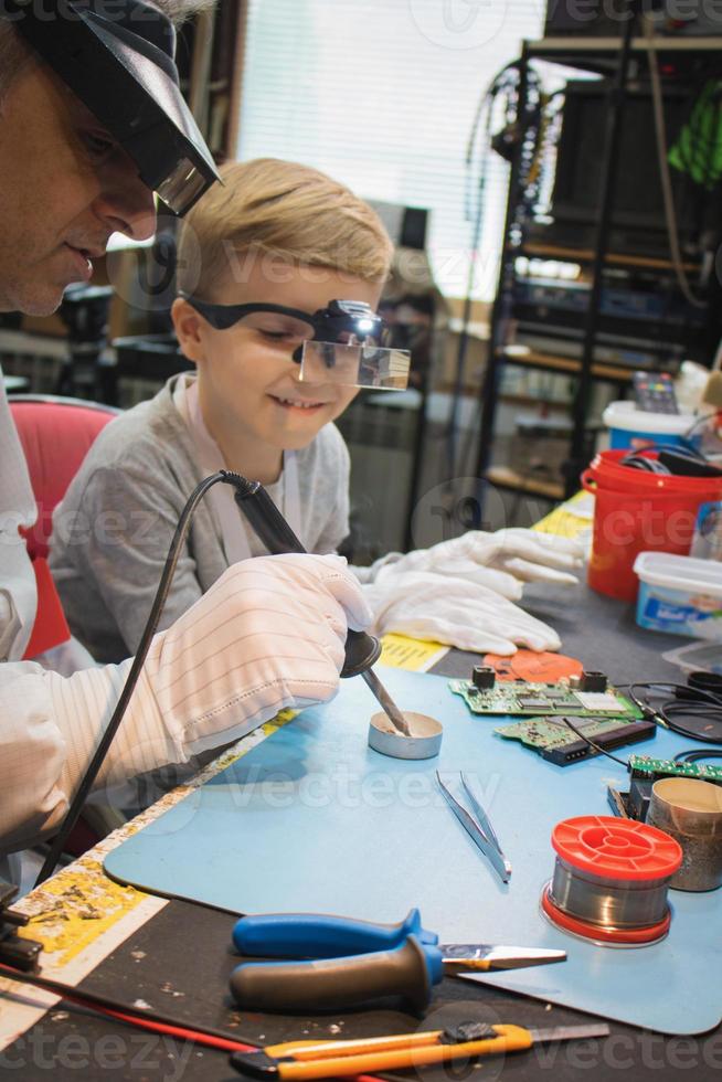 Using soldering iron in IT lab. photo