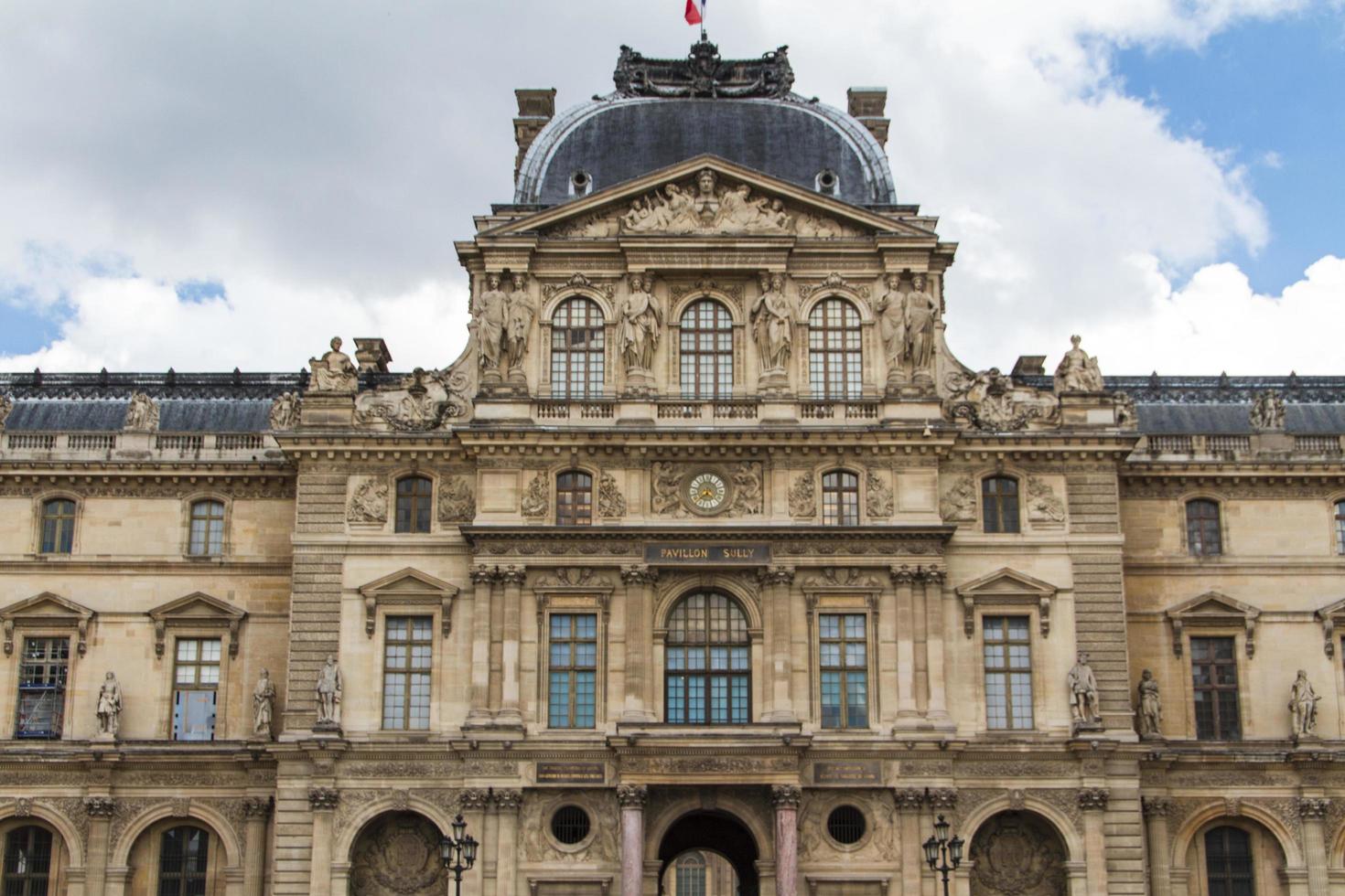 PARIS - JUNE 7 - Louvre building on June 7, 2012 in Louvre Museum, Paris, France. With 8.5m annual visitors, Louvre is consistently the most visited museum worldwide. photo