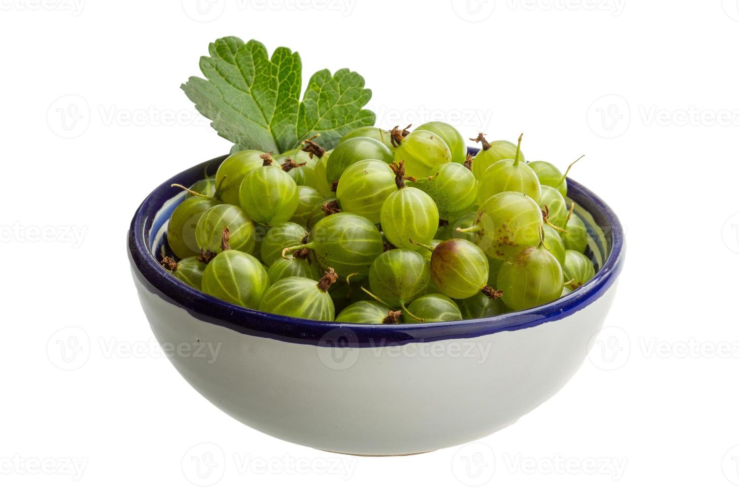 Gooseberry in a bowl on white background photo
