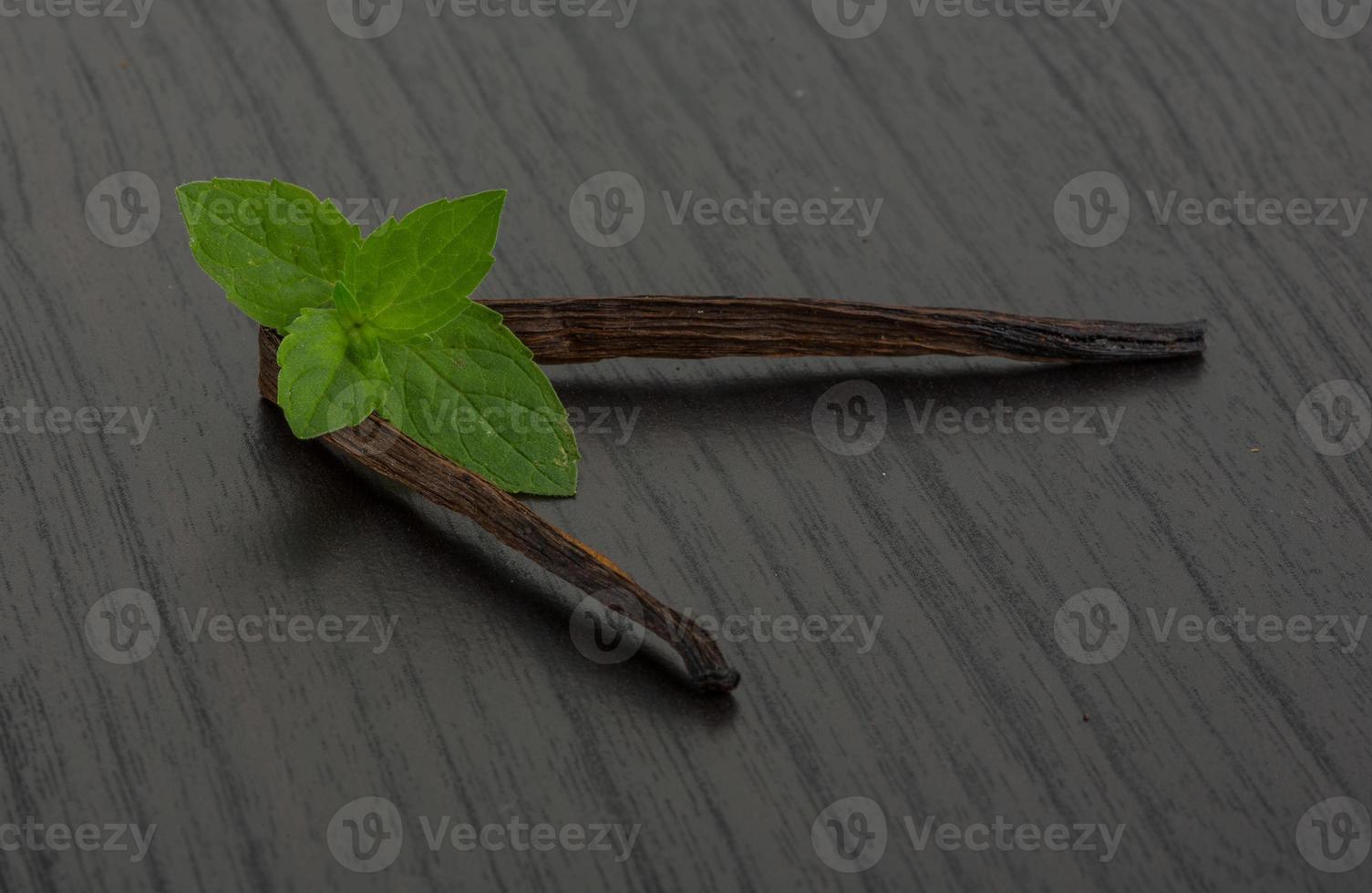 Vanilla on wooden background photo