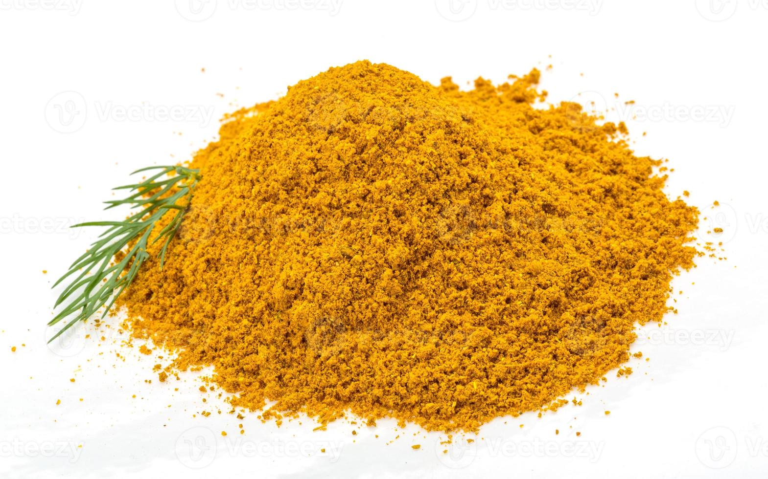 Curry powder on white background photo