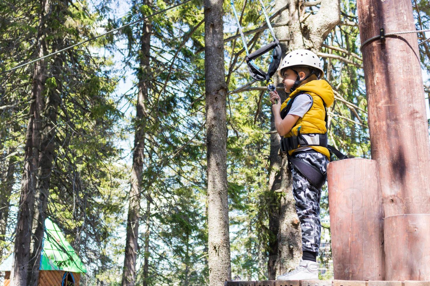 He is prepared for rappelling from a zip line. photo