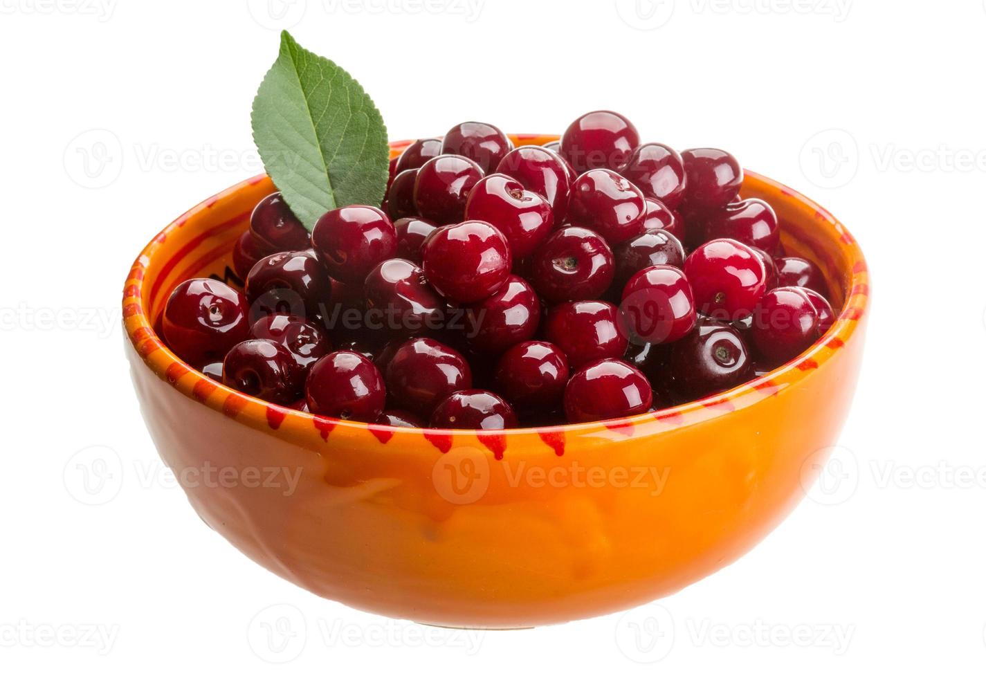 Cherry in the bowl on white background photo