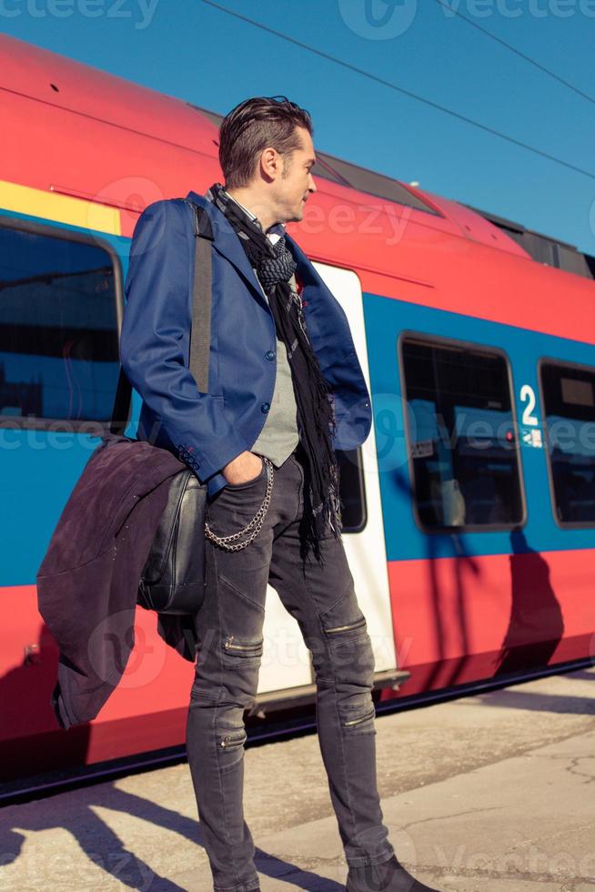 Below view of man standing by the train. photo
