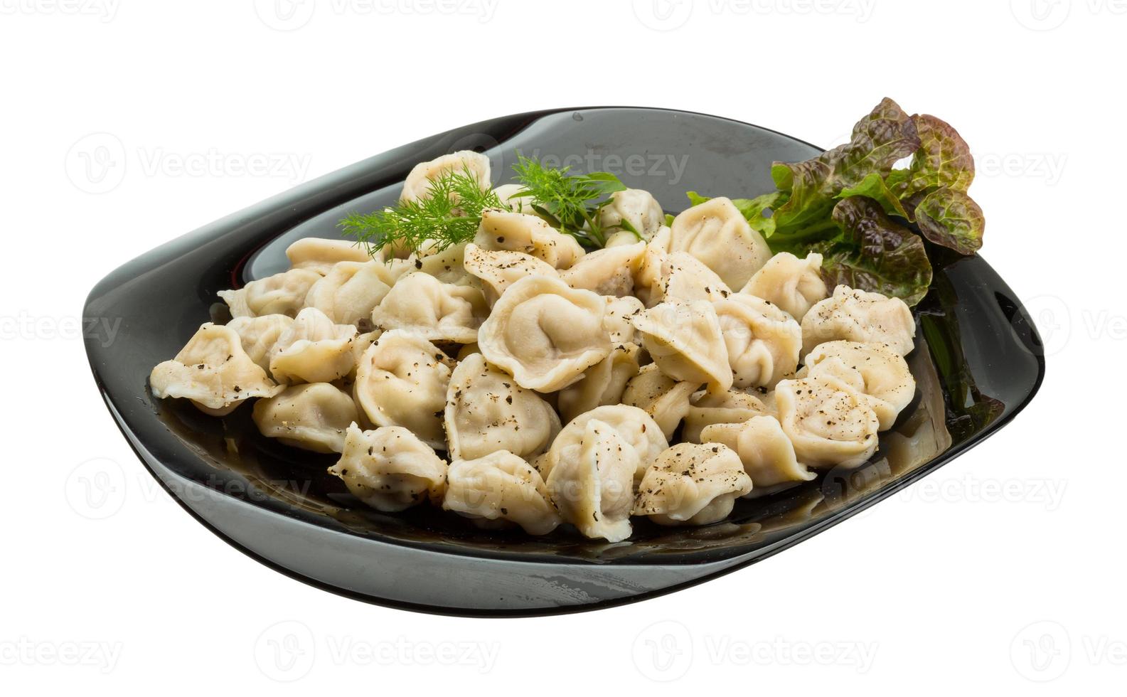 Russian dumplings on the plate and white background photo