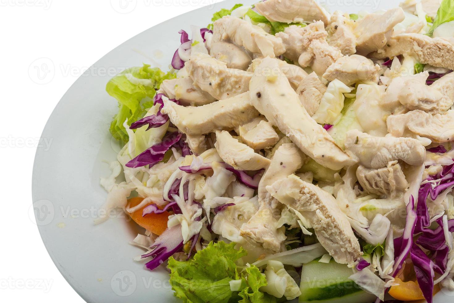 Chicken salad on the plate and white background photo