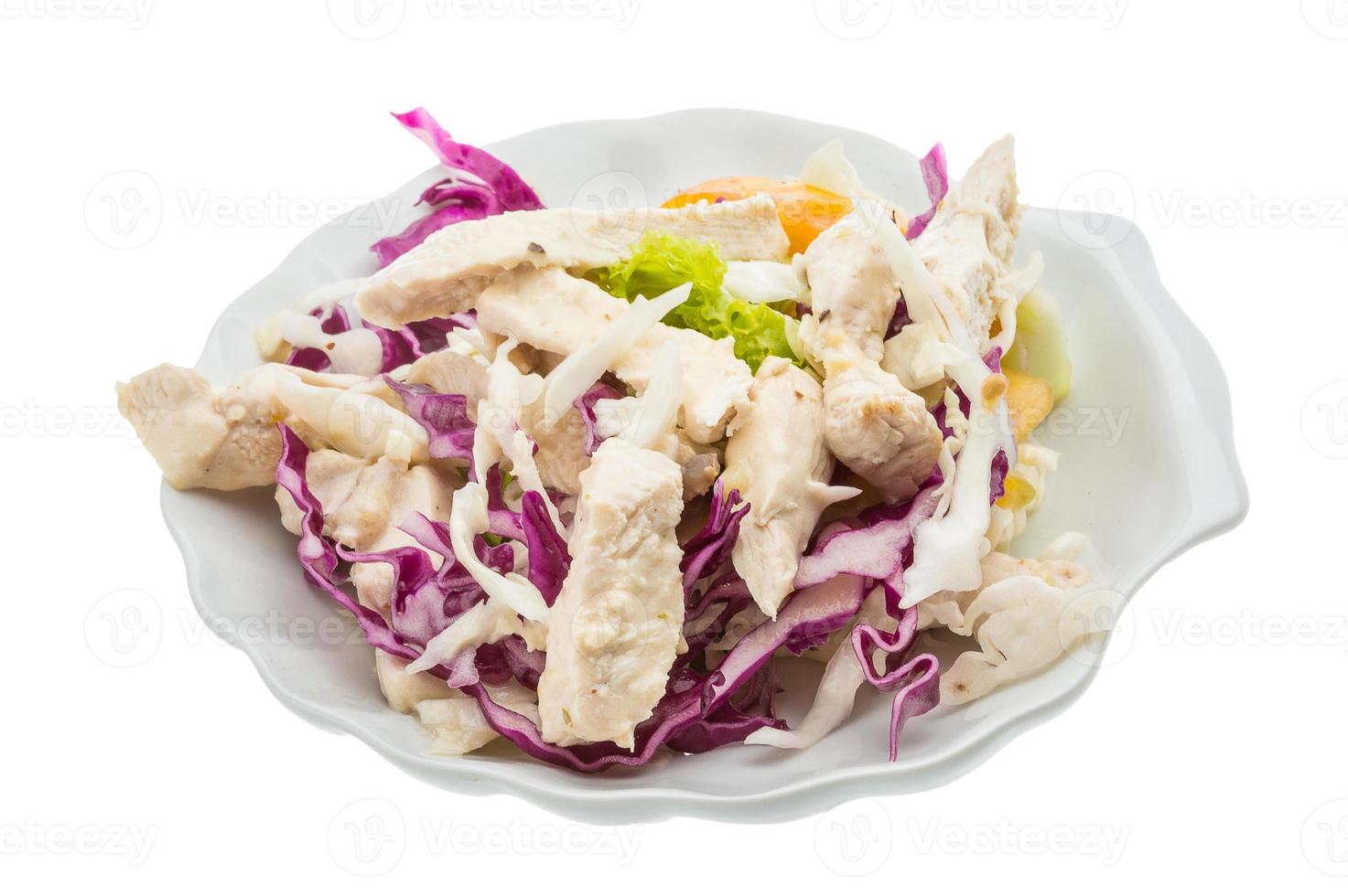 Chicken salad in a bowl on white background photo