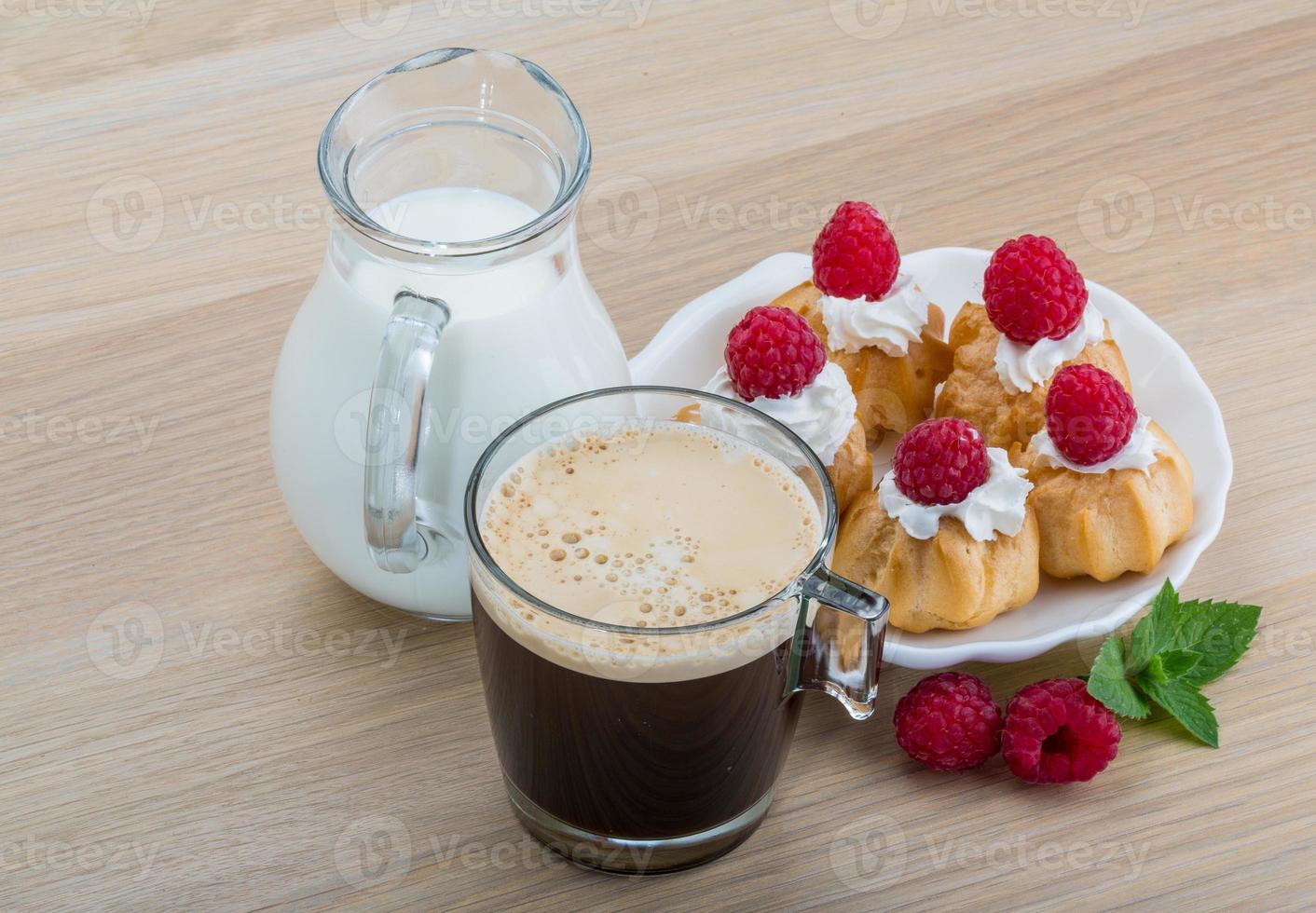 Profiterole with raspberry photo