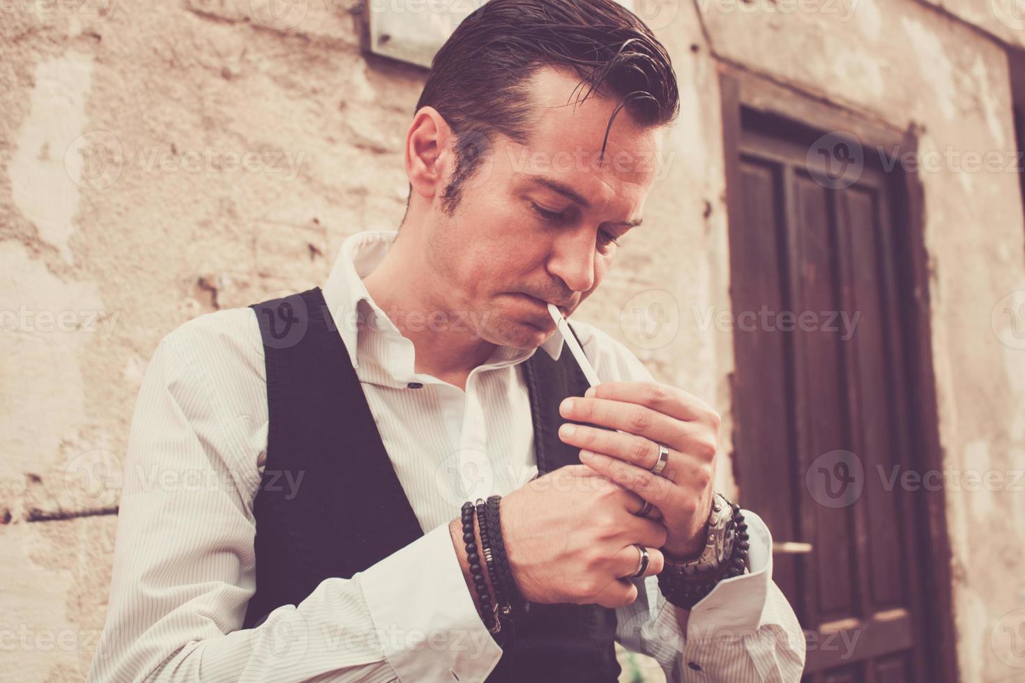 Man lightning a cigarette. photo