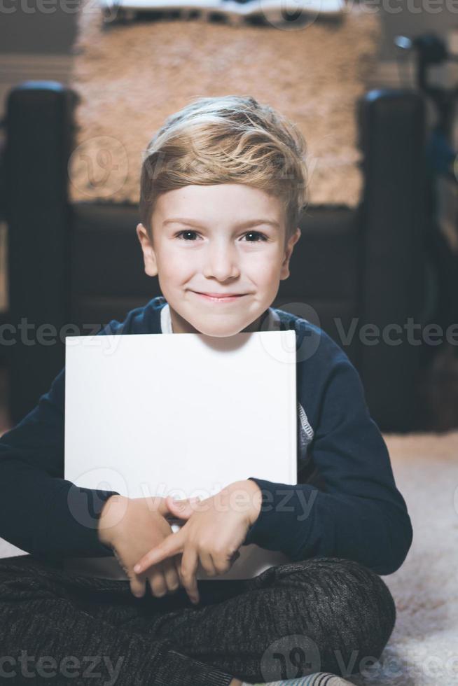 Portrait of cute kid with a book. photo