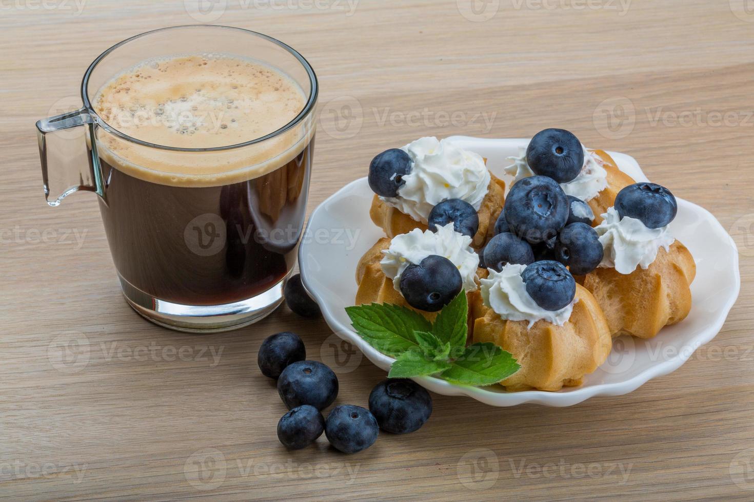 Profiterole with blueberry photo
