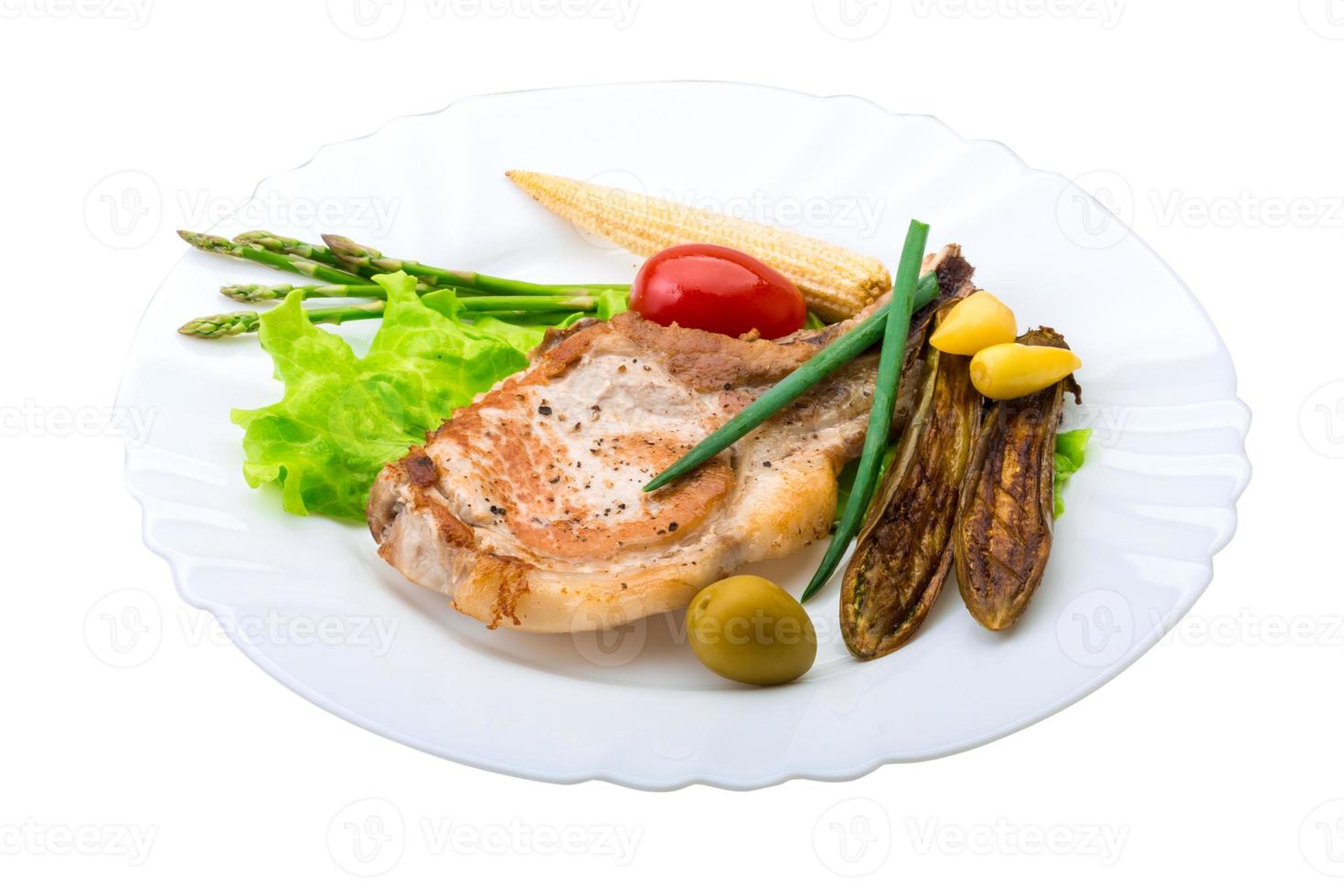 T-bone steak on the plate and white background photo