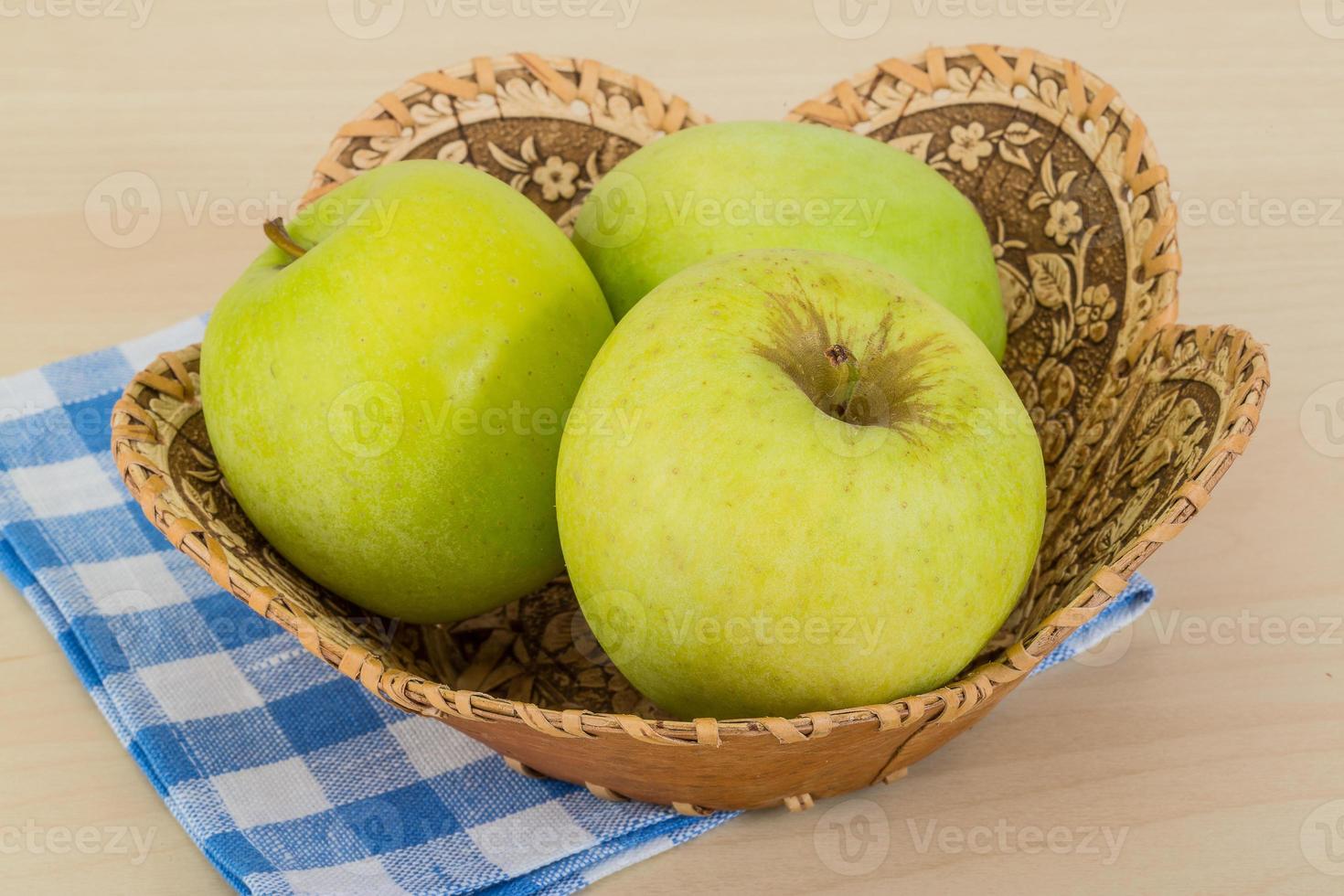 Green apple in a bowl photo