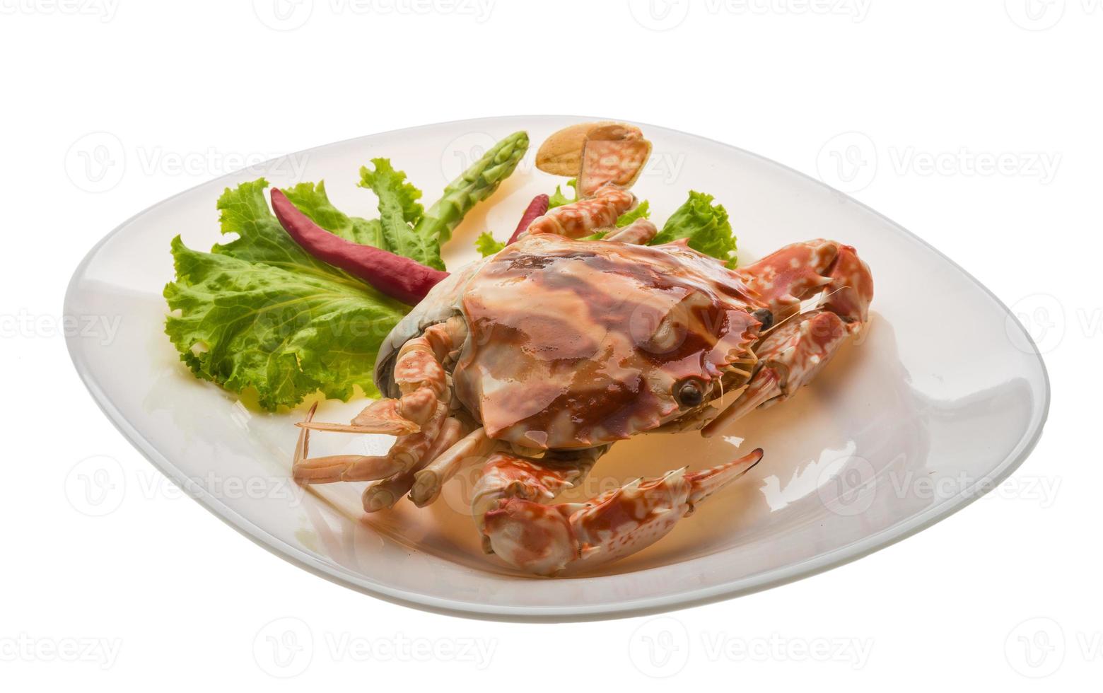 Red crab on the plate and white background photo