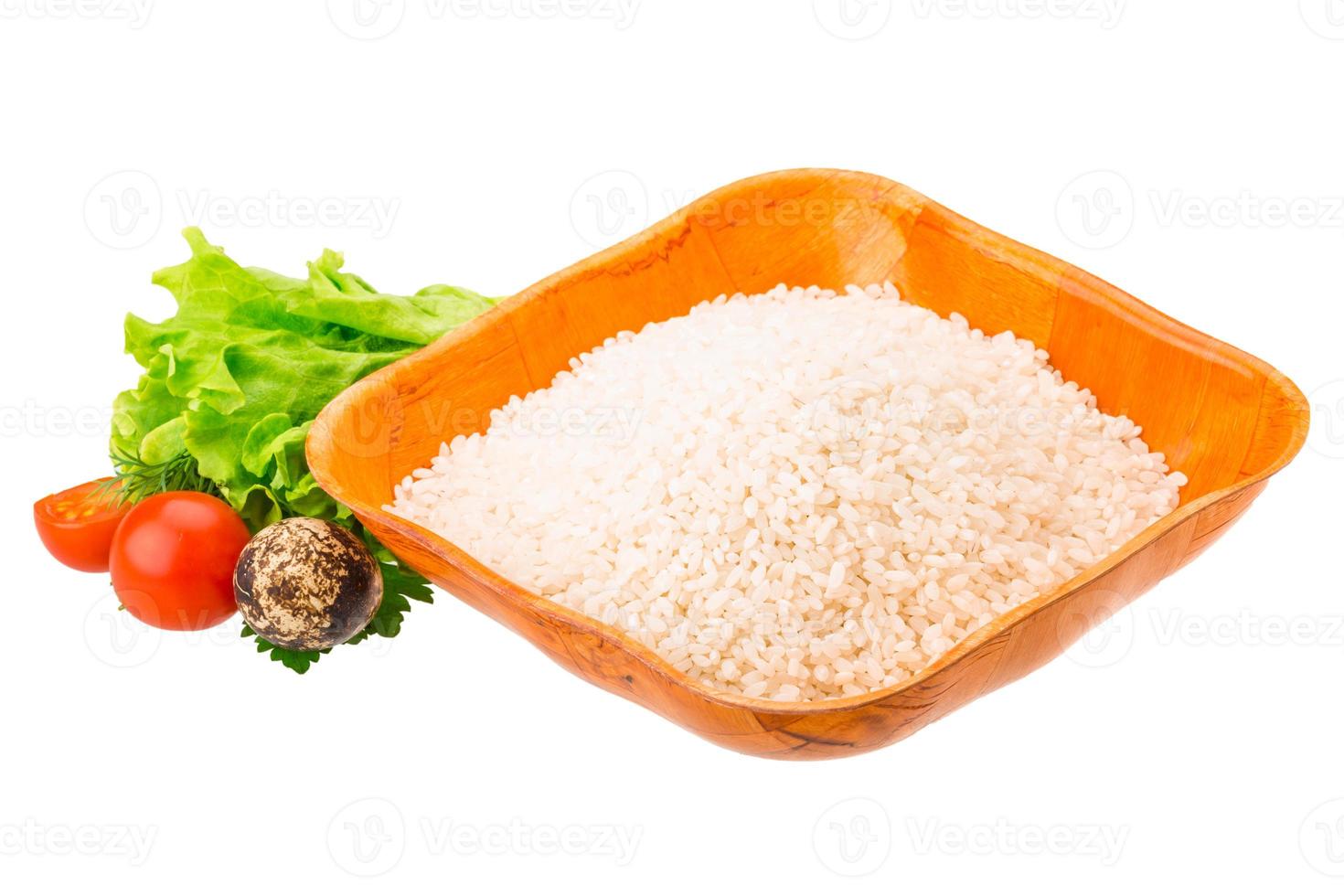 Rice in a bowl on white background photo
