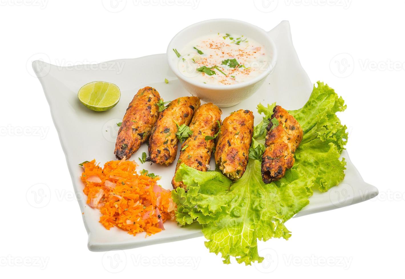 Shish kebab on the plate and white background photo