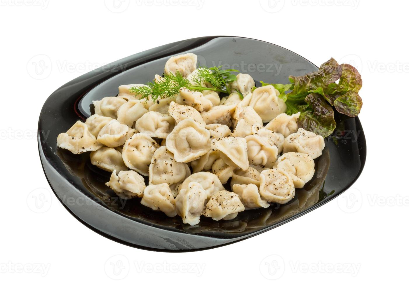 Russian dumplings on the plate and white background photo