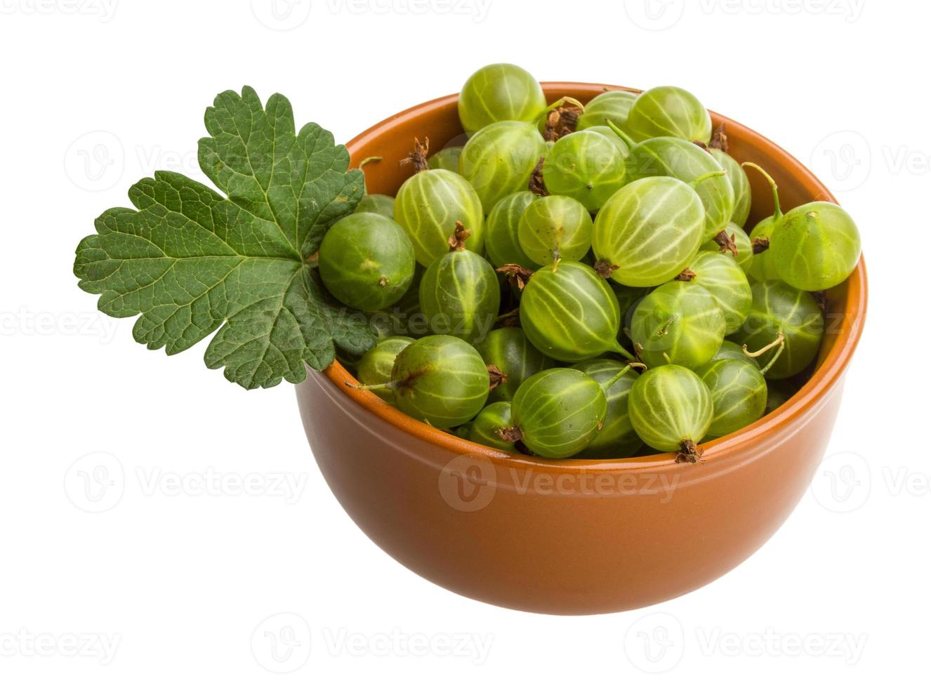 Gooseberry in a bowl on white background photo