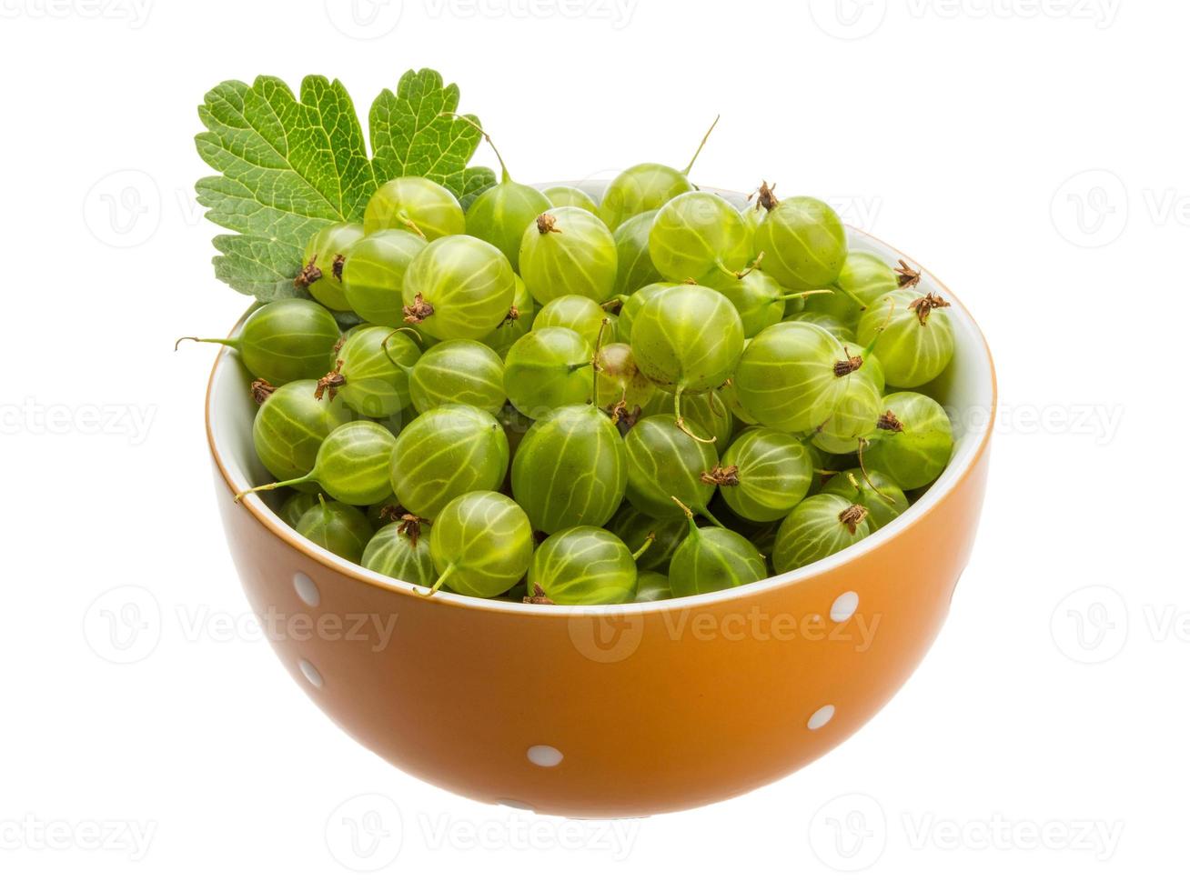 Gooseberries in a bowl on white background photo