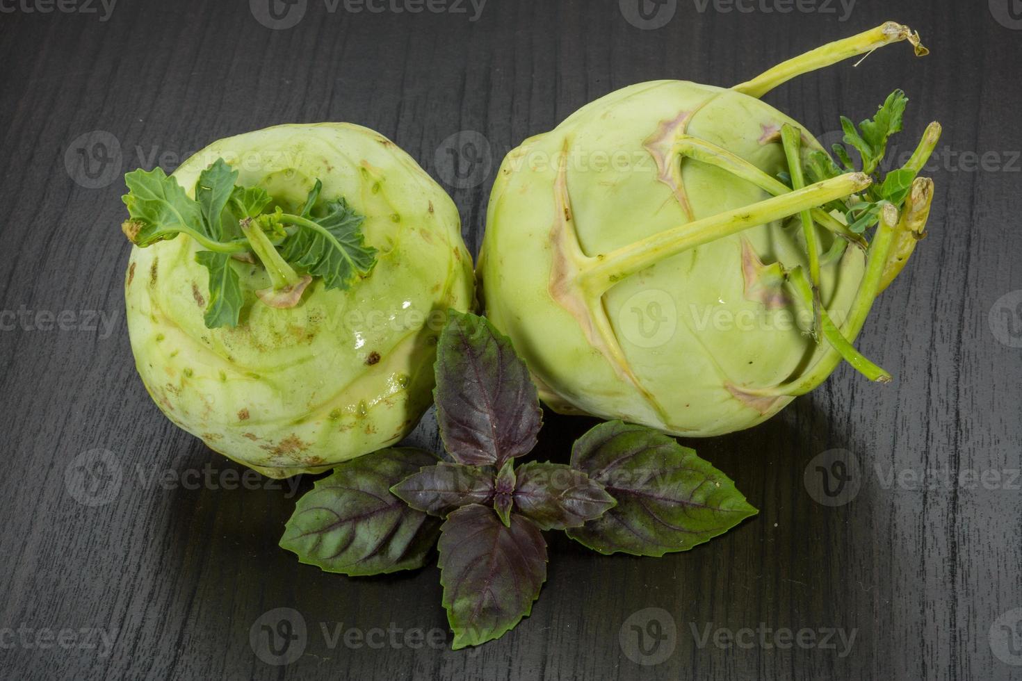 Kohlrabi on wooden background photo