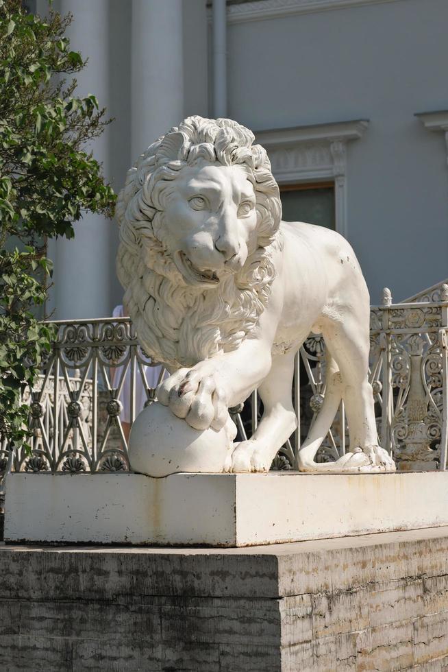 ancient lion sculpture made of stone. vertical shot of lion statue, travel in Europe, classic architecture and odl buildings sightseeing. photo