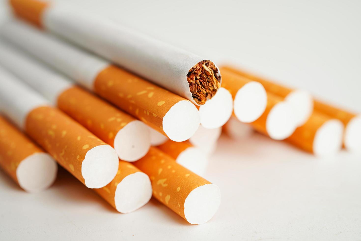 Cigarette, roll tobacco in paper with filter tube, No smoking concept. photo