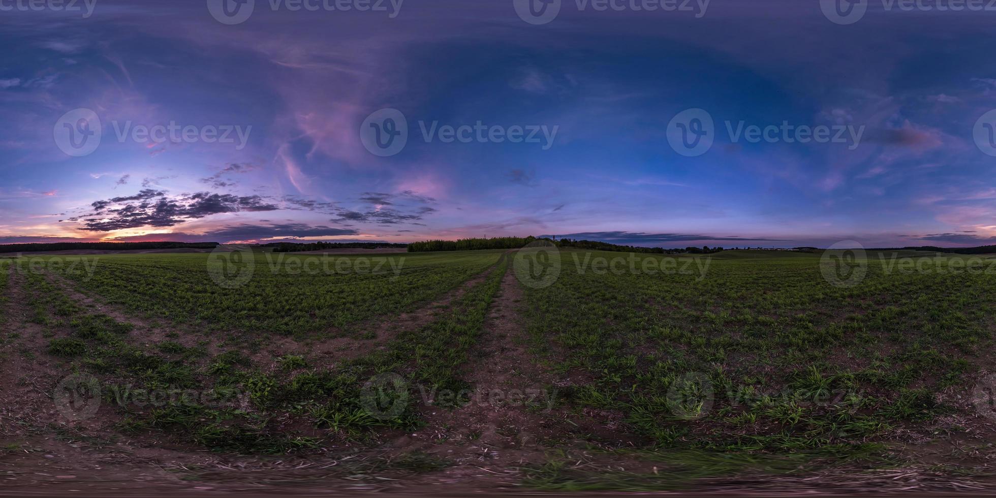 full seamless spherical hdri panorama 360 degrees angle view on asphalt road among farm fields in autumn evening before sunset with storm clouds in equirectangular projection, ready for VR AR content photo