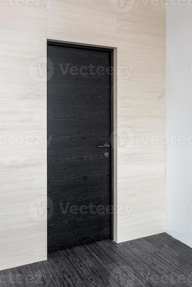 black wooden door in dark style color for modern interior and apartments flat or office photo