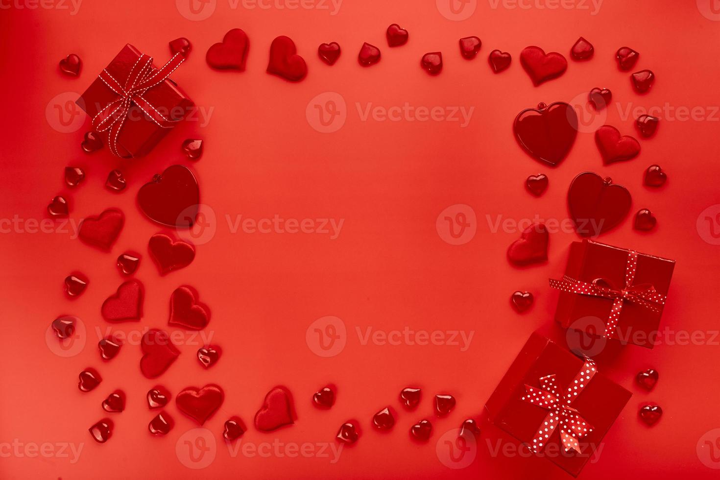 Red hearts on red background. Romantic background for Valentine's day photo